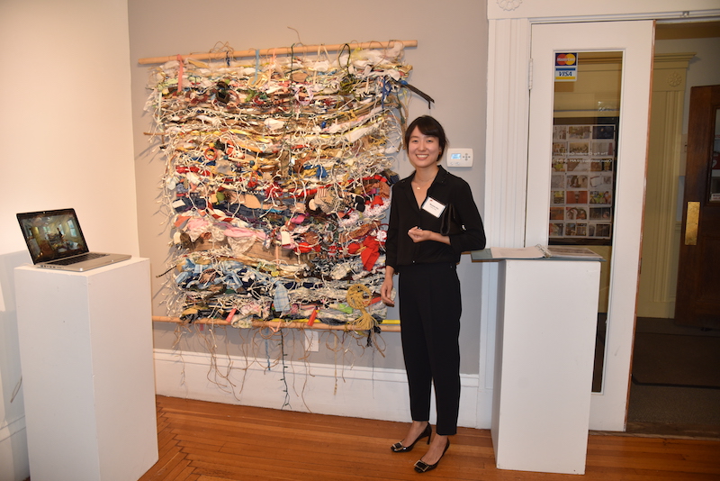 Artist Woomin Kim at her opening reception of